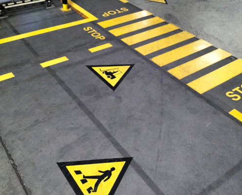 Industrial Building Corridor Painted Yellow Between Parallel Yellow Lines