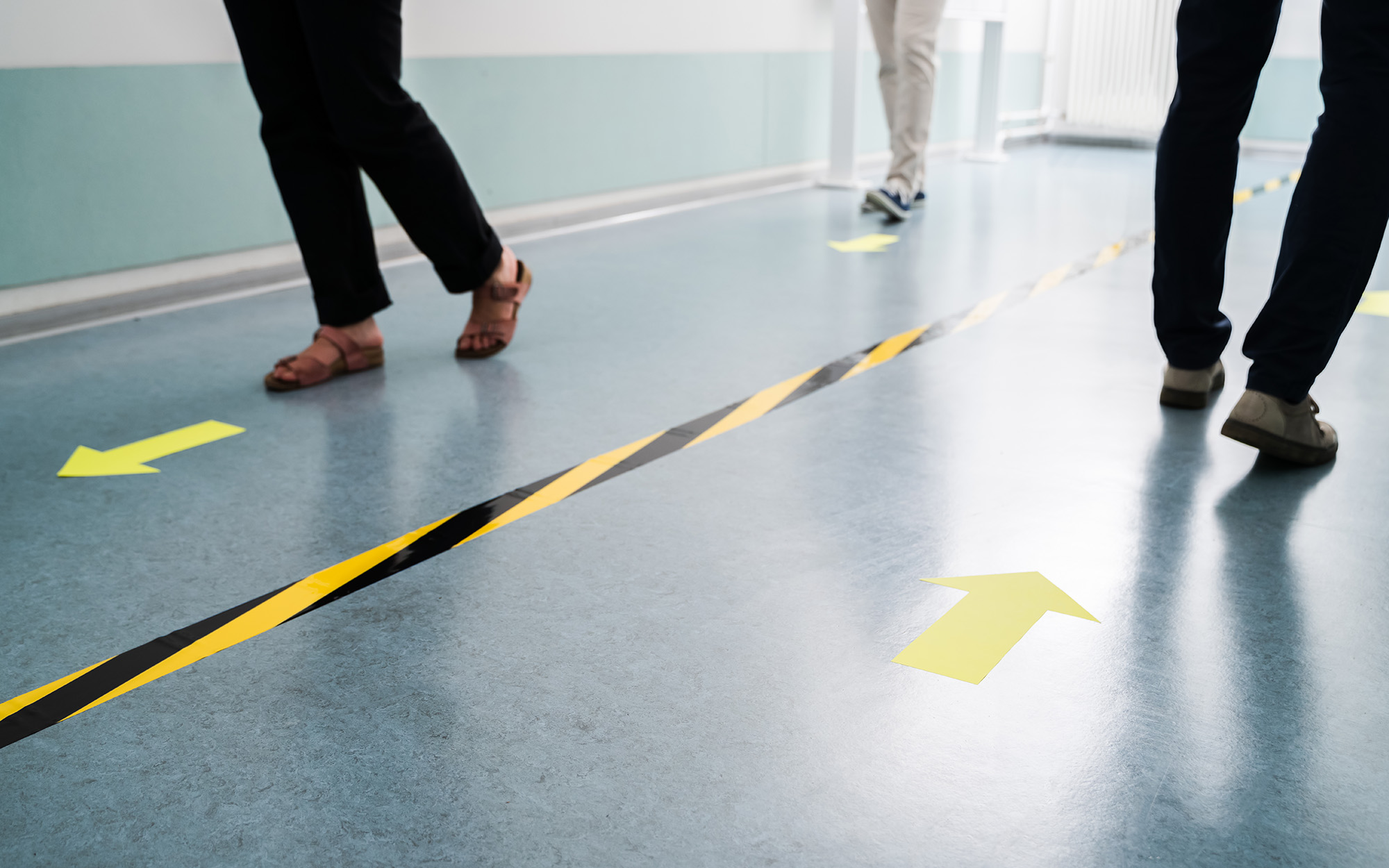 People In Office Following Social Distancing Tape Markings People In Office Following Social Distancing Tape Markings